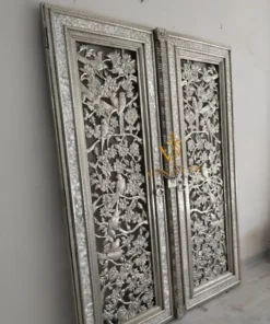 Intricate floral and bird design on a handcrafted German silver temple door panel