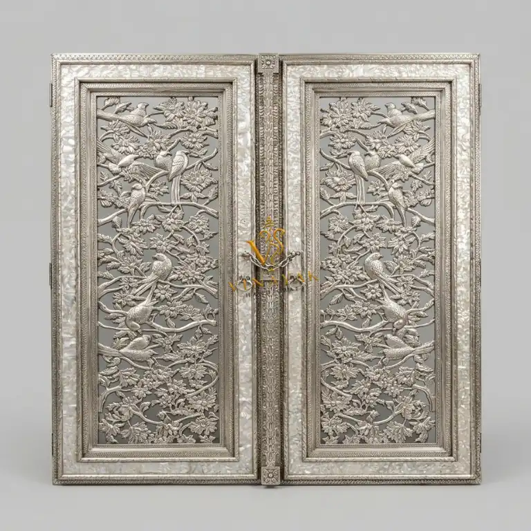 German silver carved temple double door with matching ornamental frame in a luxury temple entrance