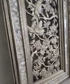 Ornamental leaf carvings on the frame of a German silver temple double door